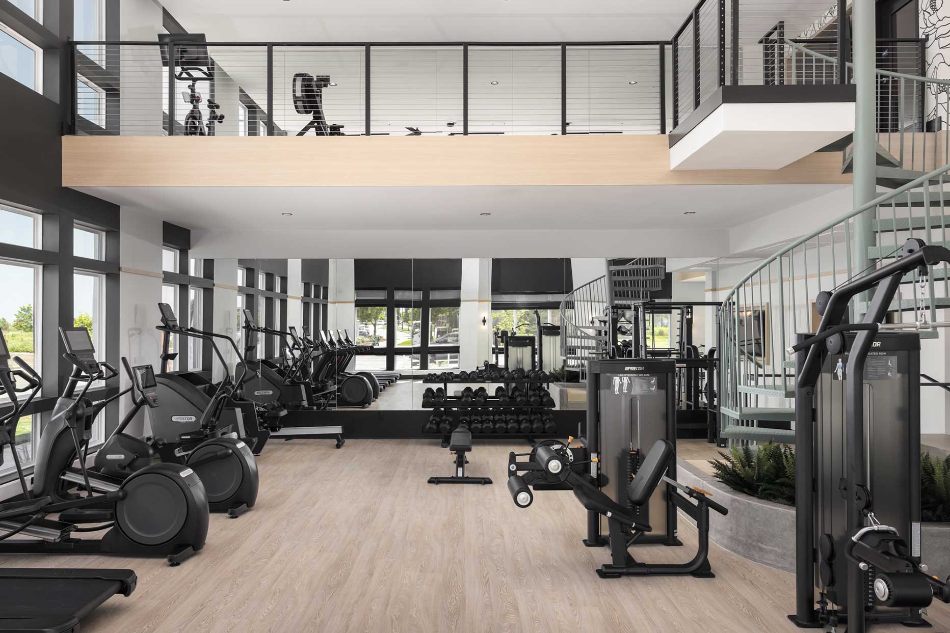 Fitness center with machines at RYE Central Park luxury apartments in Denver, CO