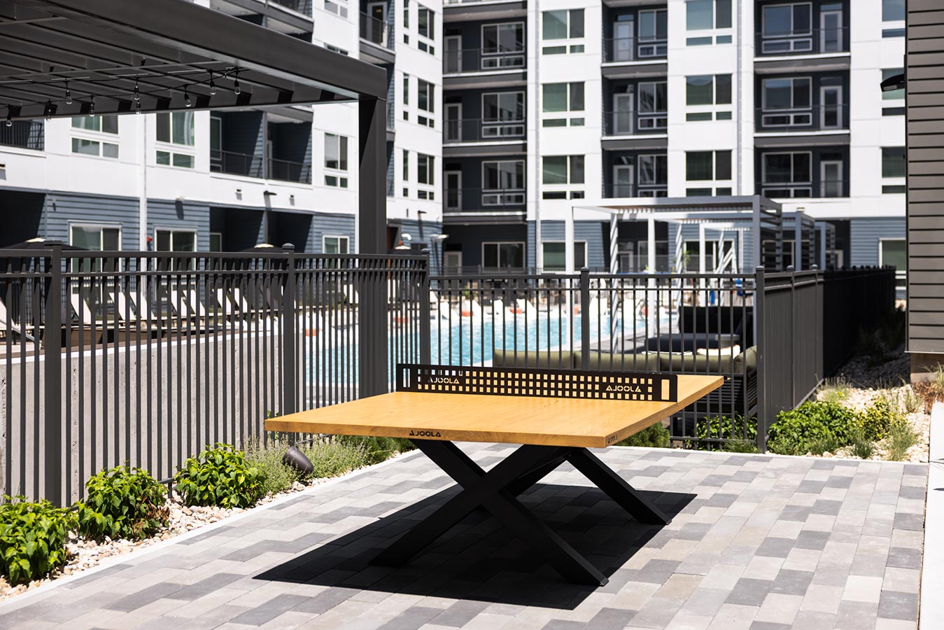 View of the pool with ping pong table for activities