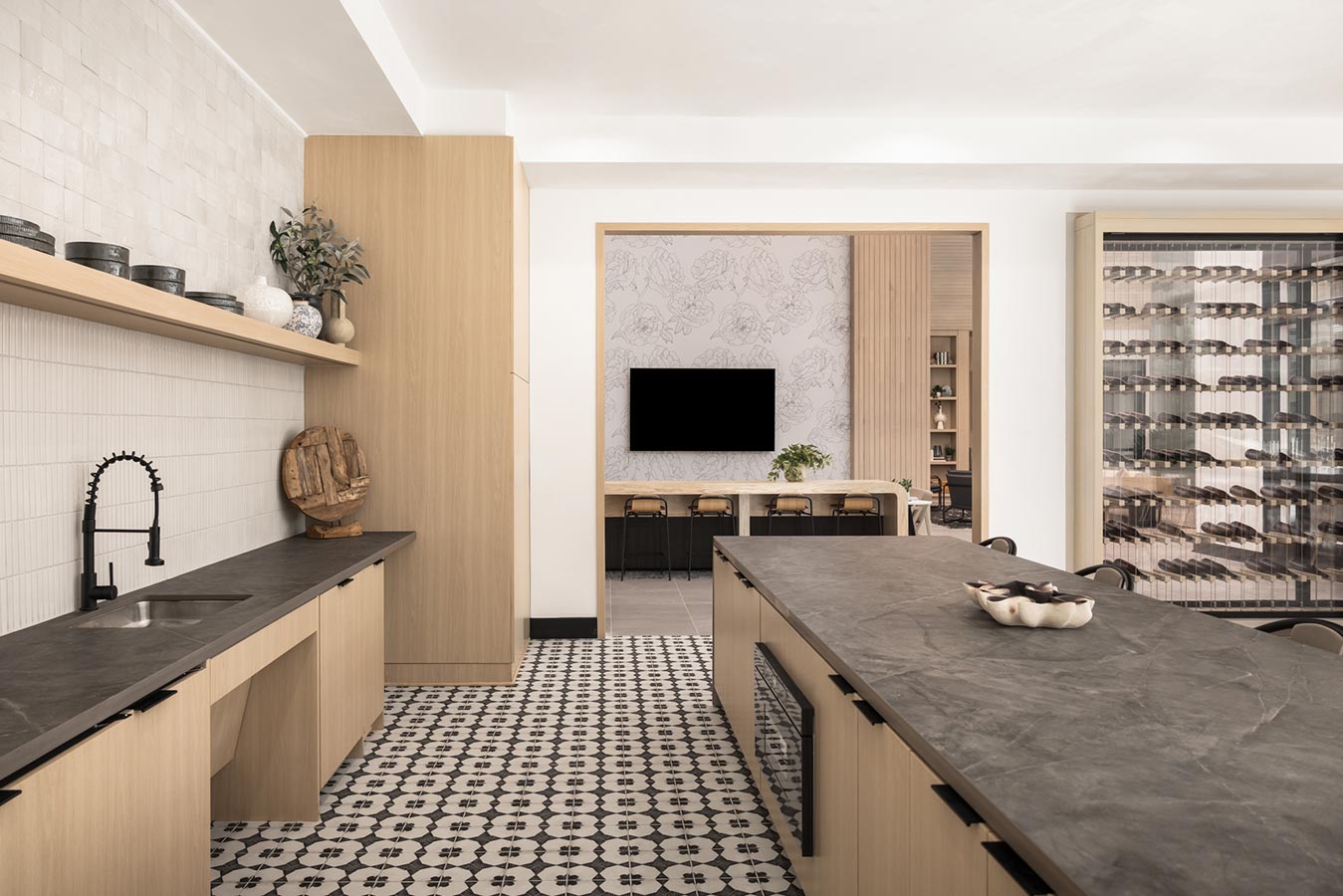 Clubhouse area to host with sink, TV, and sitting space