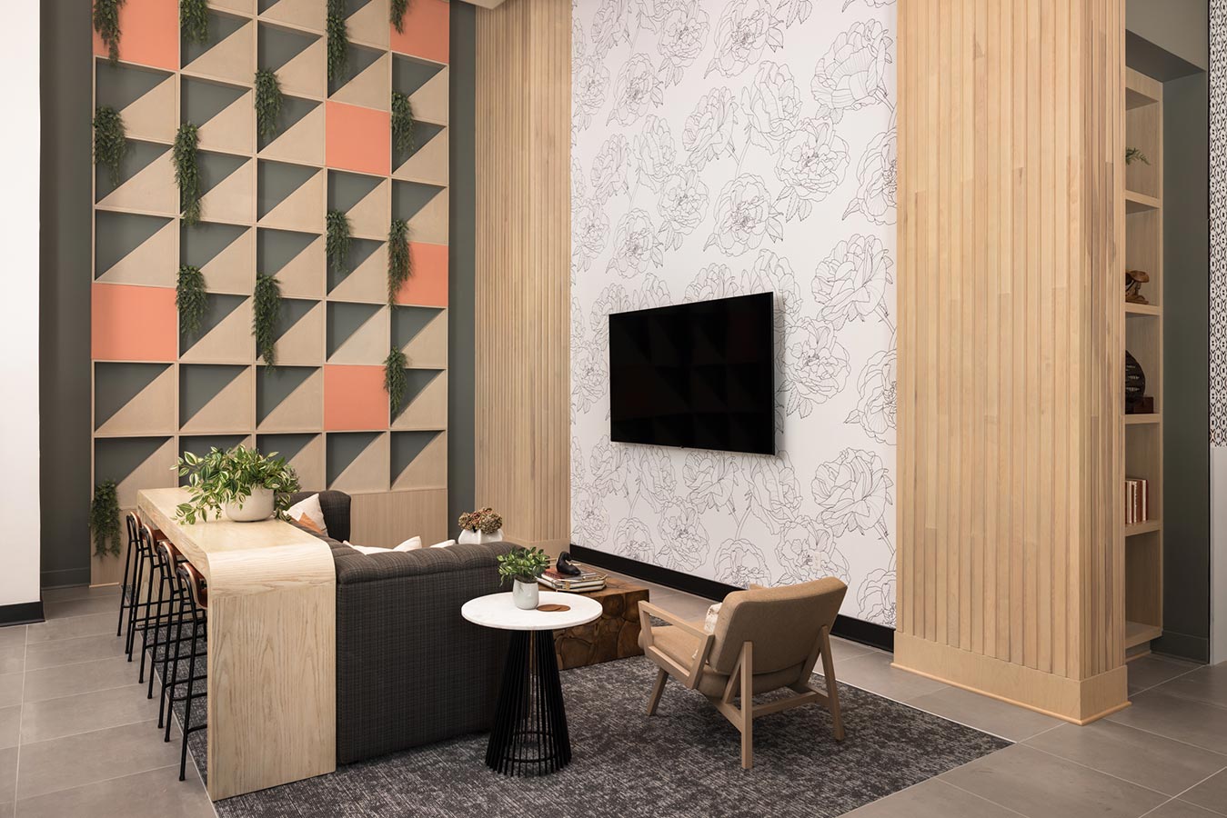 Lounge area in the lobby with TV and couch