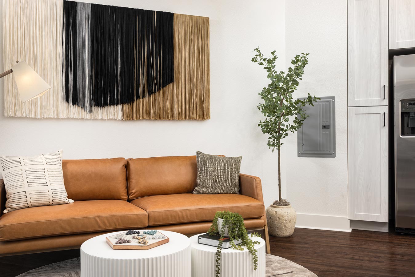 Living room with couch, wall art and tables