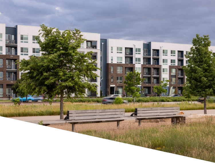 Street view of exterior buildings at RYE Central Park apartments near downtown Denver